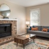 living room with couch coffee table and fireplace