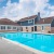 a swimming pool in front of a building