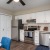 a kitchen with white cabinets